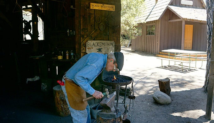 YT-Pioneed-History-Blacksmith-2_Gloria_680 Blacksmith demonstration at the Pioneer Yosemite History Center. Photo by Gloria Wadzinski