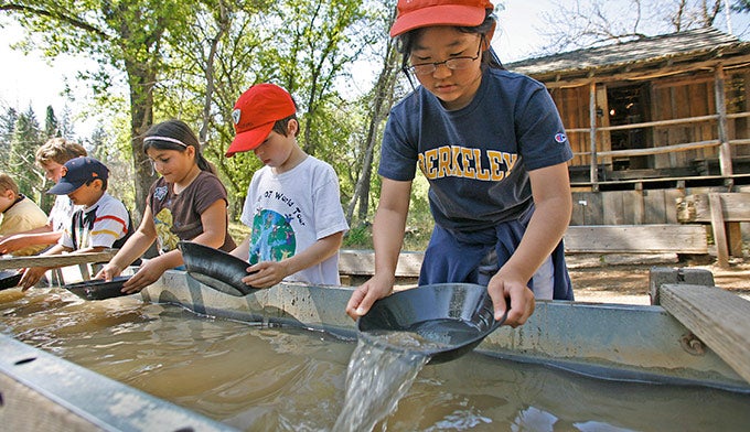tuolumne-columbia-state-park-gold-panning_courtesy_rickemartin_680 Kids pan for gold at Columbia State Historic Park. Photo by Rick E Martin courtesy Tuolumne County