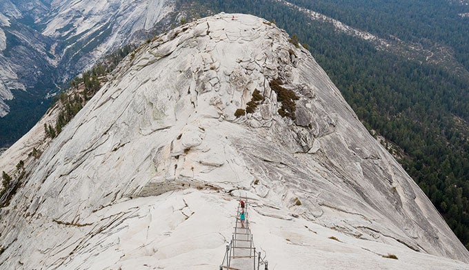 YT-Half-Dome-cables_GrantOrdelheide_680 Cables assist hikers on the final 400 feet up Half Dome in Yosemite.