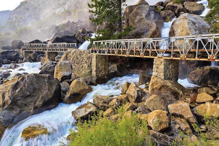 YT-Hetchy-Wapama-Falls_shutterstock_700 Footbridge past Wapama Falls in northwest Yosemite