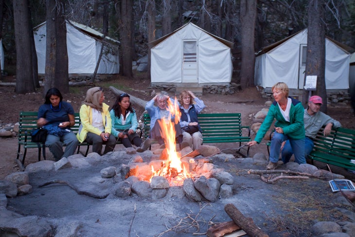 Campers sit around the community fire pit at Yosemite's Glen Aulin High Sierra Camp